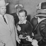 Lee Harvey Oswald was accused of assassinating President Kennedy from the book depository in Dallas in November of 1963, but we'll never be able to prove it in a court of law because Jack Ruby murdered Oswald on his perp walk outside of Dallas police HW. Somewhere in Oliver Stone's dreams, a Cuban is enjoying a cigar with a CIA agent.